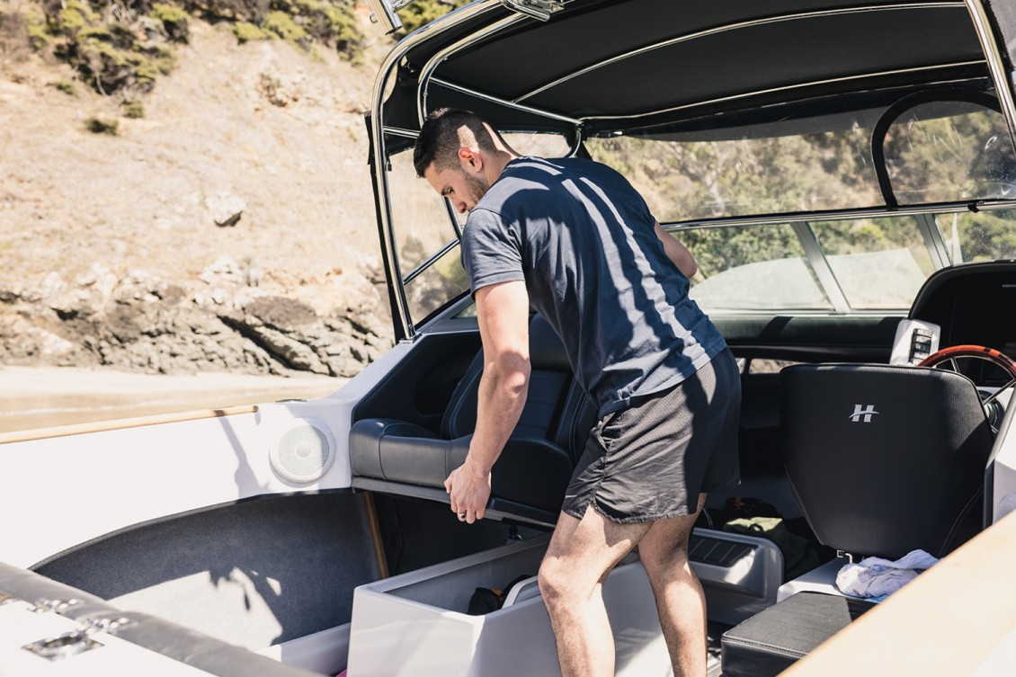 Deluxe back-to-back seats with copious storage beneath | REDHOT Marine