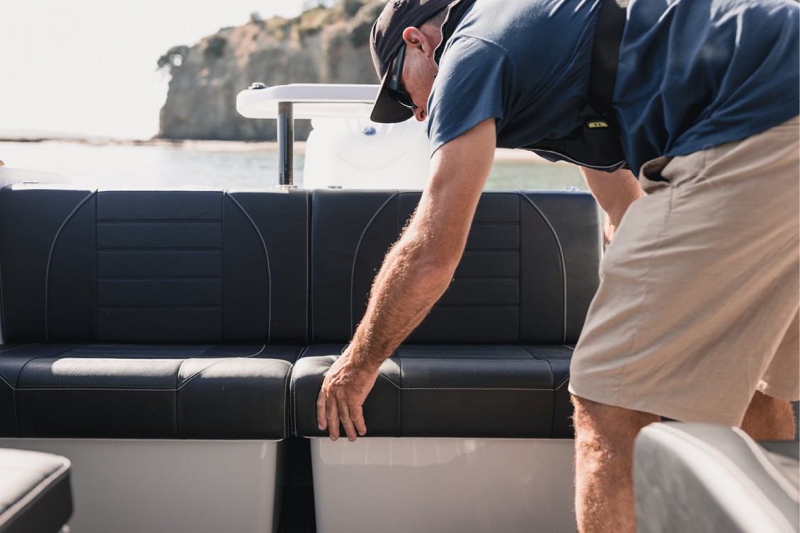 Removable squabs with storage bins below that push under the transom providing maximum deck space | Haines Hunter